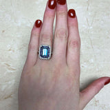 Platinum European cut Diamond and Emerald Halo set Ring