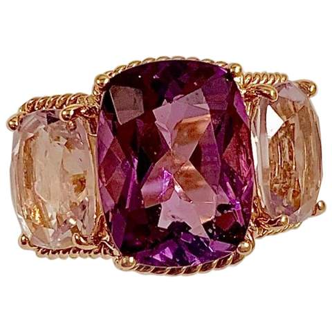 18kt Yellow Gold Three Stone Ring with Pink Topaz and Blue Topaz and Rope Twist Border