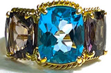 Elegant Three Stone Garnet Ring with Gold Rope Twist Border