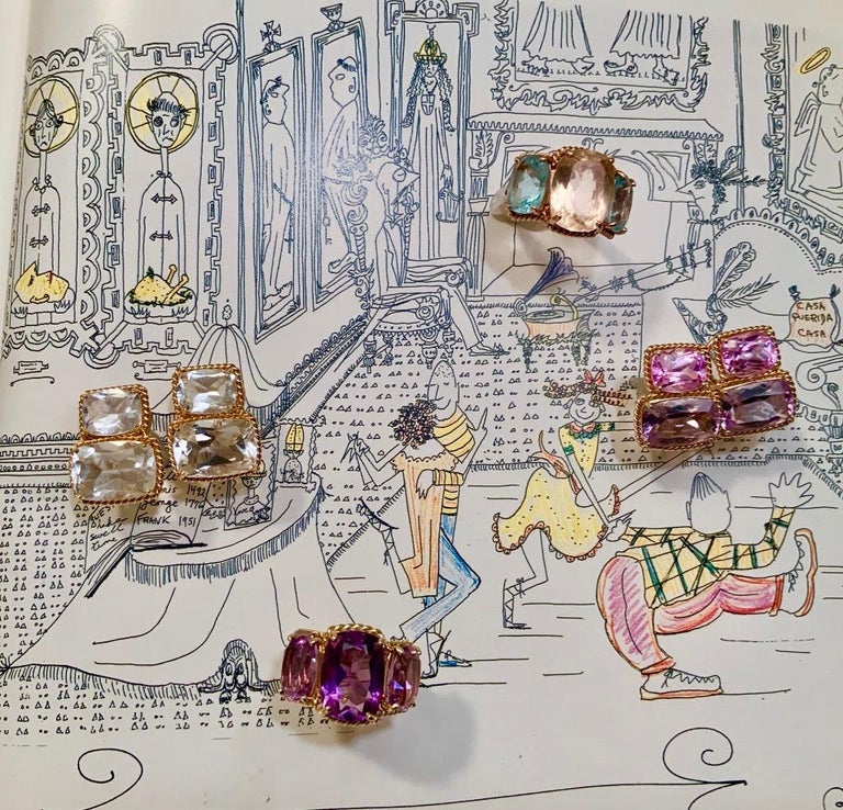 18kt Yellow Gold Three Stone Ring with Pink Topaz and Blue Topaz and Rope Twist Border