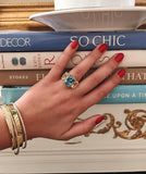 Elegant Three-Stone Rock Crystal and Pink Topaz Ring with Gold Rope Twist Border
