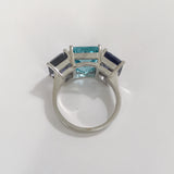 18kt White Gold Three Stone Emerald Cut Ring with Blue Topaz and Iolite